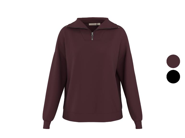 Bordeauxrode sweater met halve rits en kraag, getoond met kleurstalen voor bordeaux en zwart.