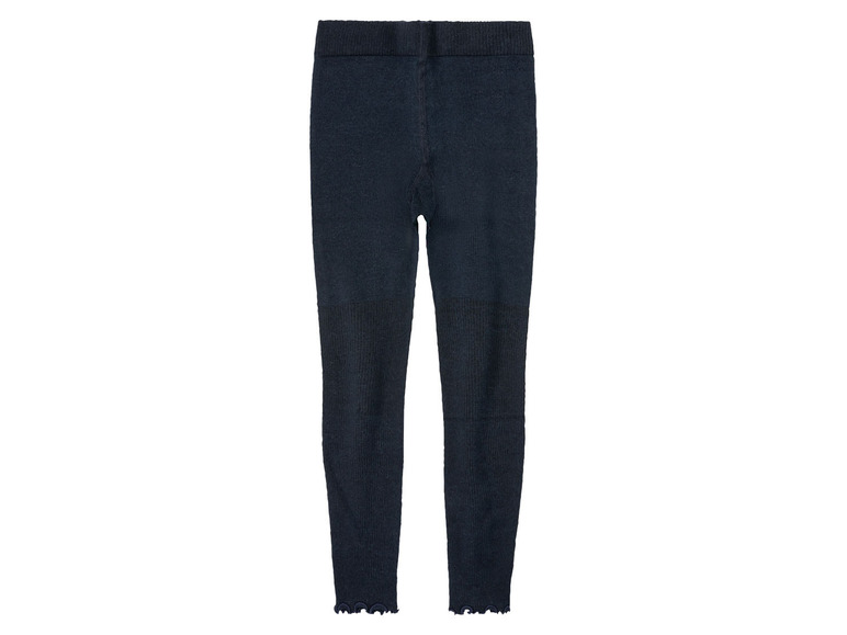 Donkerblauwe leggings met ruches aan de onderkant.