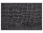Donkergrijze badmat met zachte textuur.