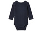 Een donkerblauwe baby romper met lange mouwen.