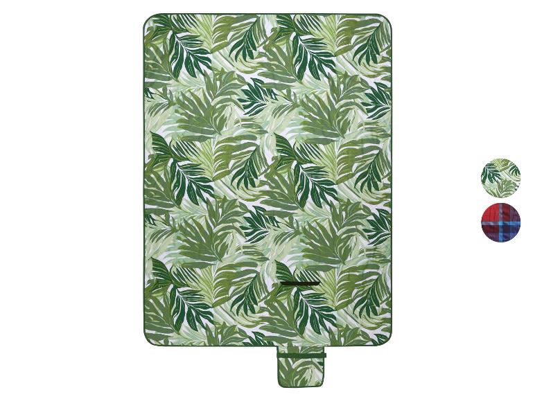 Picknickdeken met groen palmbladpatroon en een klein zakje, met twee patroonvariaties.