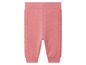 Roze joggingbroek met ribbels aan de zijkanten.