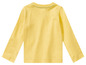 Een gele longsleeve voor baby's.