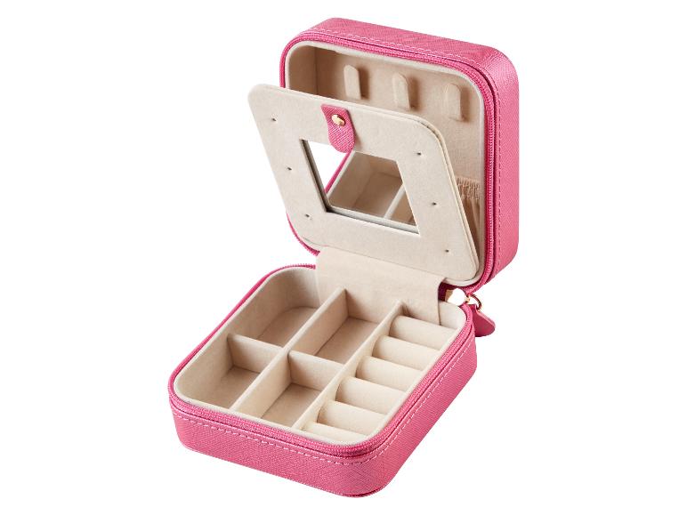 Roze juwelendoosje met spiegel en vakjes voor ringen en oorbellen.