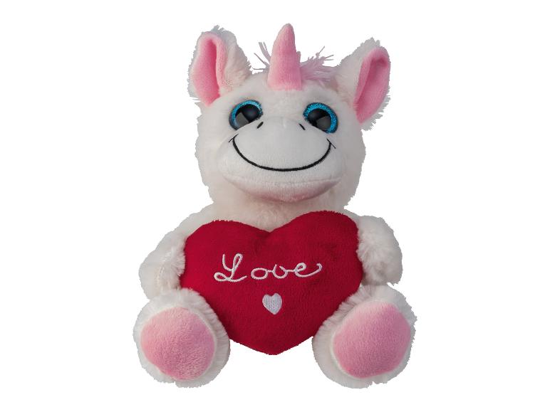 Een witte knuffelpaard met een roze hartje met 'Love' erop.