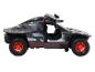 Een zwarte Audi e-tron off-road auto met rode velgen.