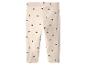 Beige kinderlegging met zwarte hartjes