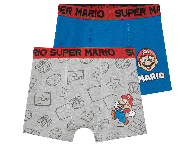 Twee Super Mario boxershorts voor jongens: één effen blauwe en één grijze met Super Mario print.