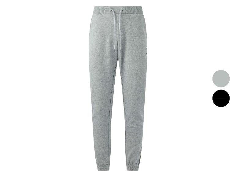 Grijze joggingbroek met trekkoord, verkrijgbaar in grijs en zwart.