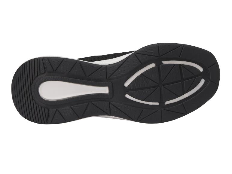 Zool van zwarte sneakers met witte details.