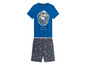 Pyjama met een blauwe T-shirt met een astronaut print en een korte broek met sterren.
