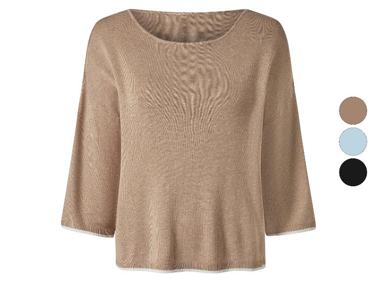 Beige gebreide trui met driekwart mouwen en witte details.