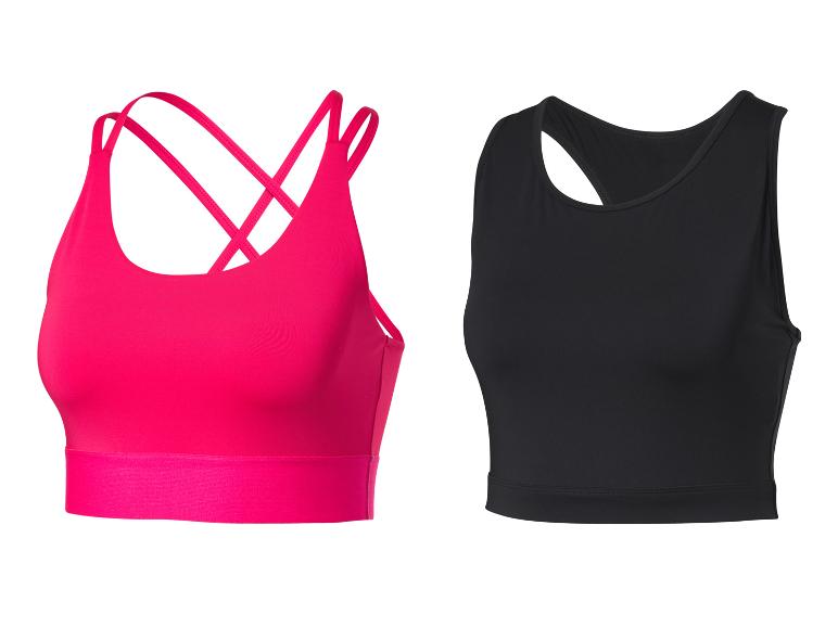 Twee sporttops: een roze sportbeha met gekruiste bandjes en een zwart topje.