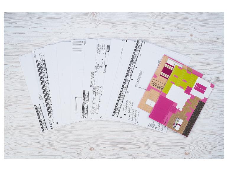 Papieren knutselset met bedrukte vellen voor het bouwen van een miniatuurhuis of -kamer.