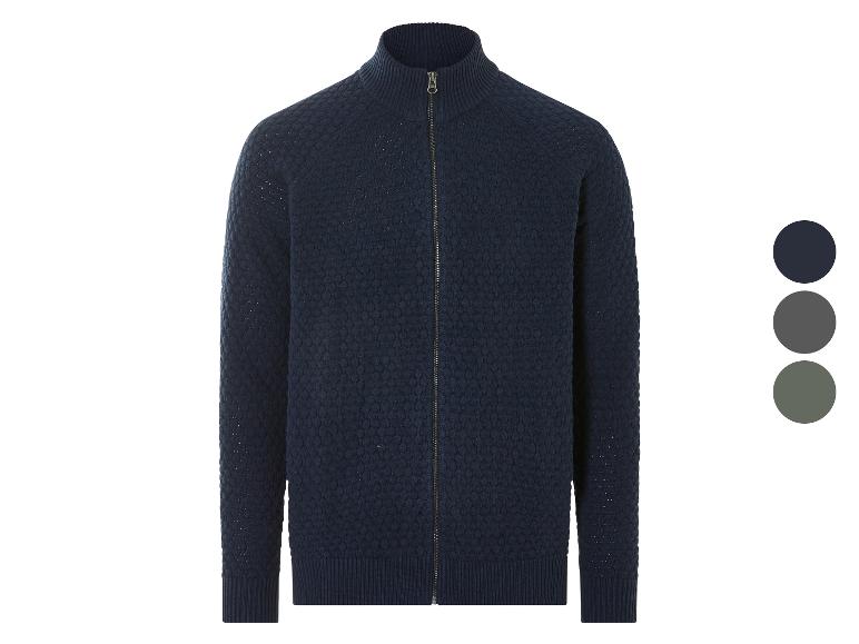 Een donkerblauwe gebreide trui met ritssluiting.