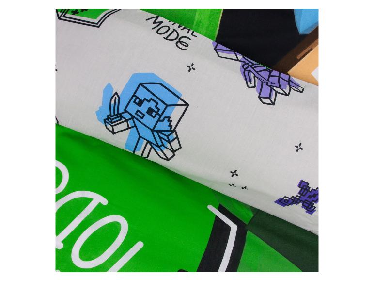 Beddengoed met pixelkarakters en de tekst „MODE”.