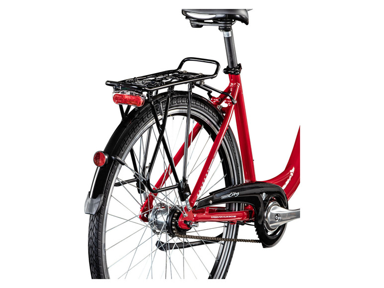 Een rode Gazelle City fiets met bagagedrager.