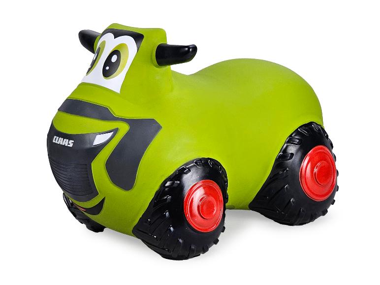 Een groene Claas speelgoedtractor voor kinderen.