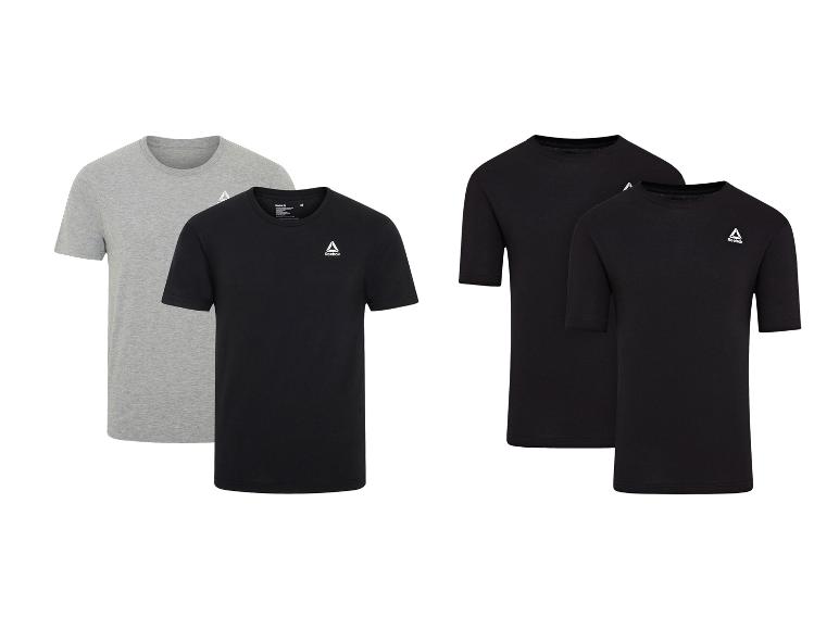 Reebok T-shirts in zwart en grijs, vier stuks in totaal.