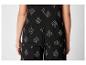 Zwart top en broek met botanische print.
