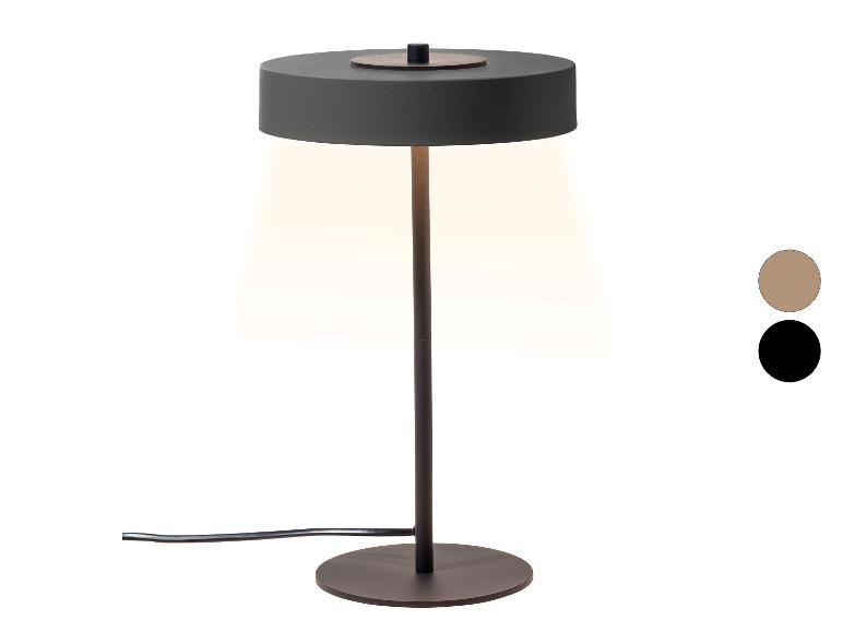 Tafellamp met een donkergrijze kap en voet, die warm licht uitstraalt, met kleurstalen.