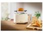 Witte 1995 toaster met brood op houten plank.