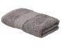 Gevouwen grijze handdoek met een getextureerde wafelband
