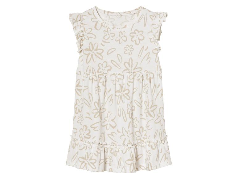 Beige babyjurk met bloemenprint, boho stijl.