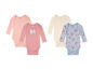 Vier baby rompers van Lupilu, waaronder een met paisley print.