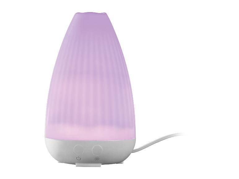 Paarse aromadiffuser met geribbeld oppervlak en bedieningsknoppen