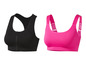 Twee sportbeha's: een zwarte met rits en een roze met brede bandjes.