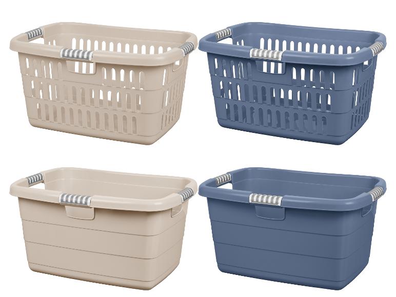 Vier wasmanden in beige en blauw met handvatten.