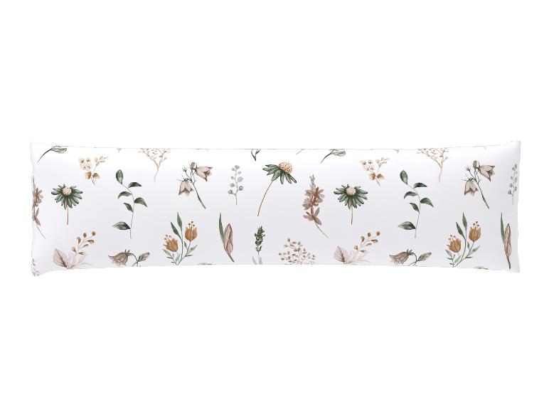 Wit kussen met bruine en groene bloemenprint.