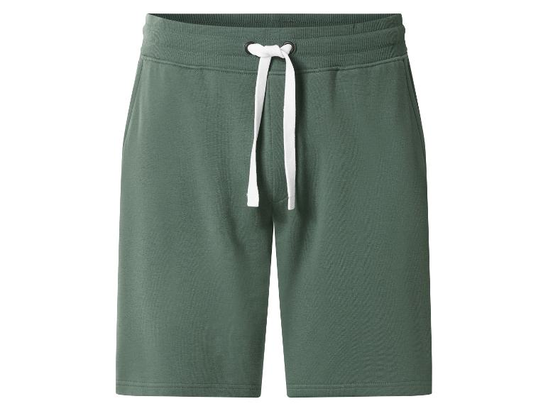 Groene joggingbroek met wit trekkoord in de taille.