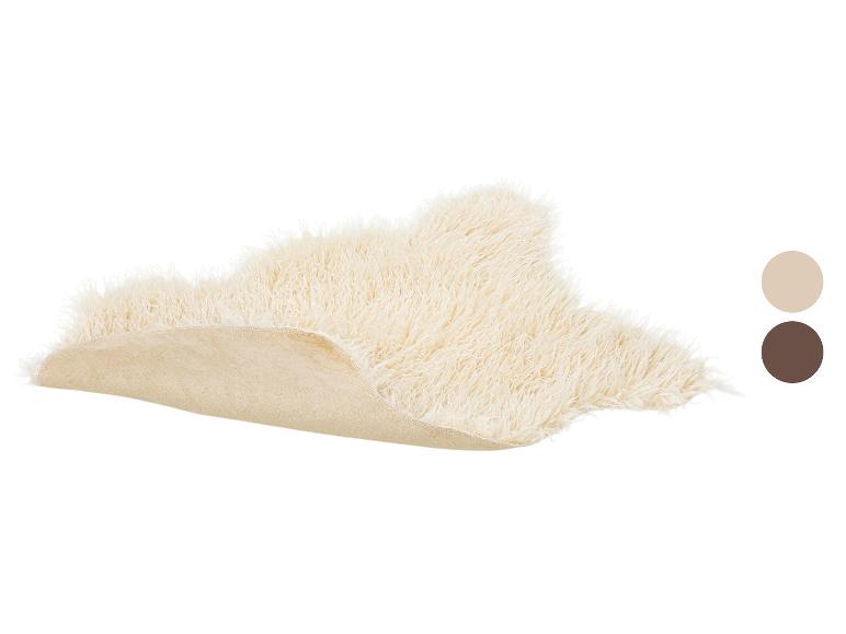 Crèmewit langharig schapenvachtkleed met een imitatie suède achterkant, met kleurstalen.