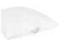 Wit gewatteerd kussen met rits, vulling zichtbaar.