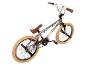 Grijze BMX-fiets met bruine handvatten en zadel, crèmekleurige banden en zwarte pedalen.