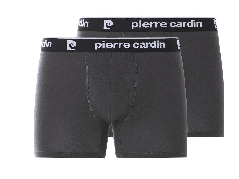 Twee donkergrijze herenboxershorts met een zwarte tailleband en witte tekst.