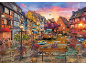 Puzzel met een schilderachtig Europees straatje aan een kanaal bij zonsondergang.