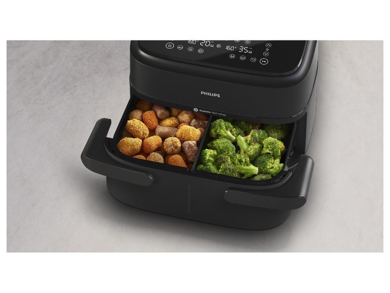 Zwarte Philips airfryer met twee manden gevuld met broccoli en kroketten.