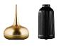 Twee aroma diffusers: een gouden en een zwarte, beide met bedieningsknoppen.