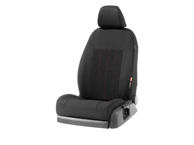 Een zwarte autostoel met rode stiksels.