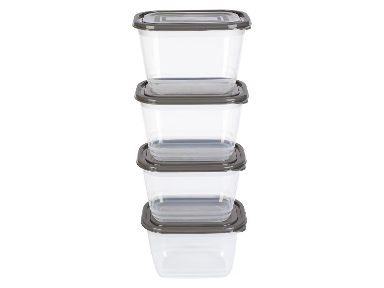 Vier stapels transparante kunststof bewaardozen met grijze deksels.