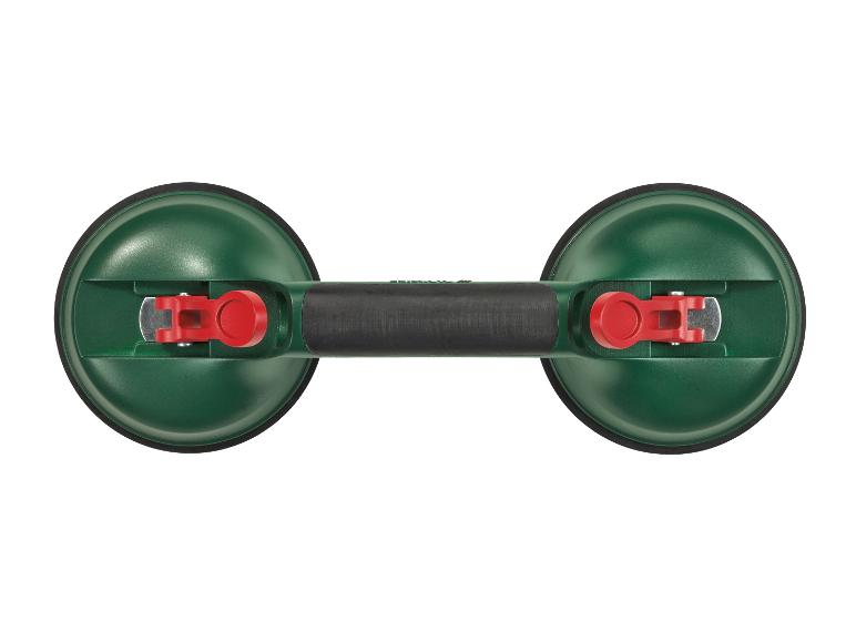 Groene dubbele zuignap met zwart handvat en rode hendels