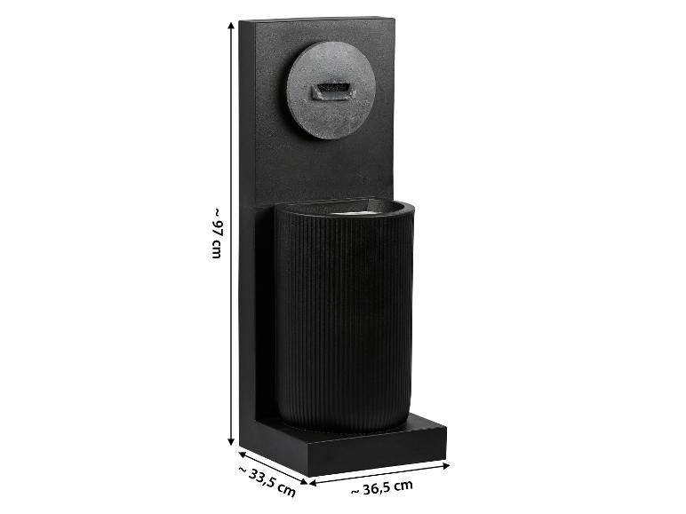 Zwarte staande lamp met geribbelde cilindrische behuizing, afmetingen ~97x33,5x36,5 cm.