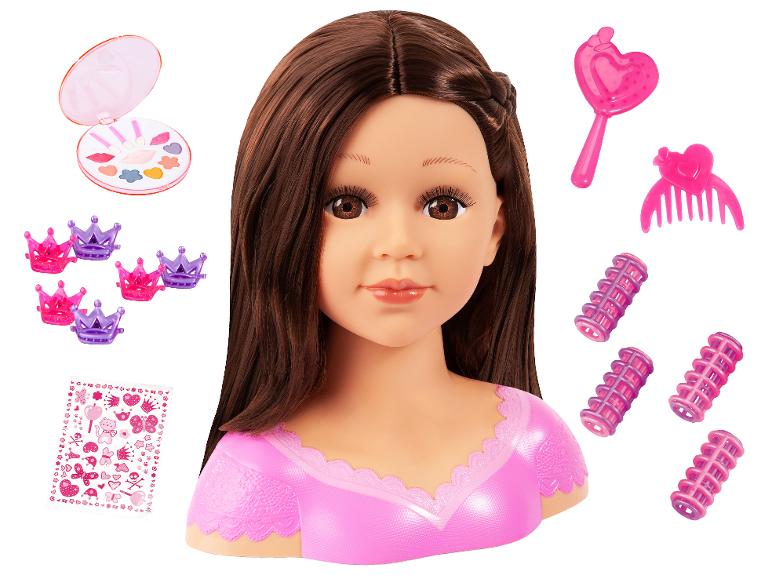 Poppenhoofd met bruin haar, make-uppalette, haarclips, krulspelden en stickers.