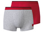 Twee paar grijze boxershorts met rode accenten.