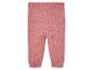 Roze gebreide leggings voor baby's.