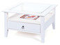 Witte salontafel met glazen blad en lade.