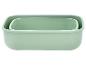 Twee rechthoekige mintgroene voedselbewaarbakjes, in elkaar gestapeld.